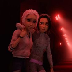 two animated women standing next to each other in a dark room with red light coming from the ceiling