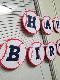 baseball themed happy birthday banner hanging on the wall