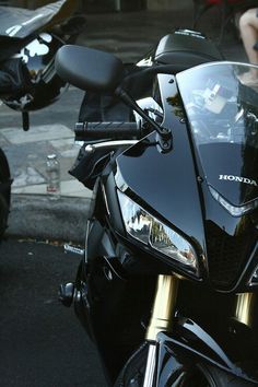 a black motorcycle parked on the side of the road