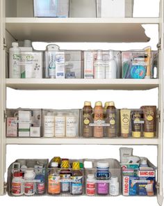 the shelves are filled with many different types of medicine and other medical supplies on them