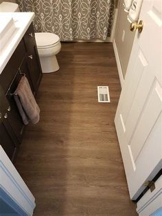 the bathroom is clean and ready for us to use it's new flooring