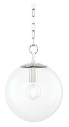 a glass globe light hanging from a chain