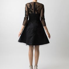 This cocktail piece is the definition of little black dress with its delicate lace applique and fit and flare skirt. The dress is fitted in the bodice with ¾ sleeves, while the crinoline underneath gives the skirt a fuller shape, emphasizing the waist.   Did we mention there are pockets? Made in Canada/ Outer 100% Polyester/ Lining 100% Polyester Crepe de Chine/ Delicate dry clean only/ Do not machine wash or tumble dry/ For a post-travel refresh, we advise using a cool iron or a gentle steam on the reverse side of any embellishment Evening A-line Dress With Lace Sleeves, Cocktail A-line Evening Dress With Lace Bodice, Fitted Cocktail Dress With Illusion Neckline, A-line Lace Dress With Fitted Bodice For Evening, Fitted Bodice A-line Lace Dress For Evening, Evening Knee-length Dress With Illusion Neckline, Fitted Lace A-line Dress, Elegant A-line Mini Dress With Sheer Bodice, Party Evening Dress With Fitted Bodice And 3/4 Sleeve