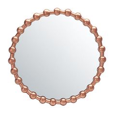 a round mirror with beads on it