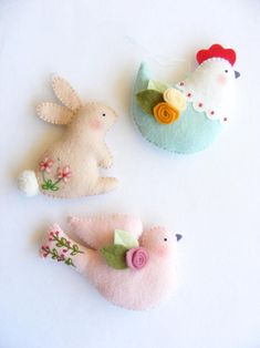 three felt easter bunnies are shown on a white background with the caption bunny, hen and dove felt