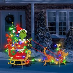 the grino is riding in his sleigh with christmas lights