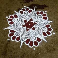 a white and red design on the ground with circles around it that have been drawn