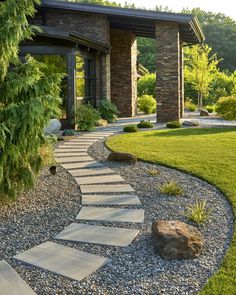 a stone path in front of a house