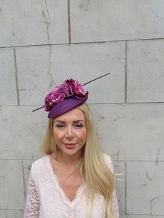 This hat is perfect for special occasions. Featuring flowers and plum statement feathers on a tilted plum disc hat. Mounted on a thin ribbon covered headband. The base measures 20cm across. Perfect for races, weddings and special occasions! Made in the UK    Many more items like this are available in our shop! Made in the UK - Aubergine Wedding, Hat Fascinator, Purple Feather, Feather Flower, Plum Purple, Fascinator, Wedding Guest, Feathers, Caps Hats