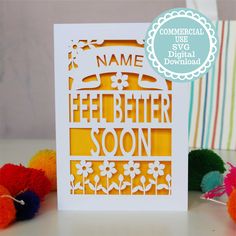 a card with the words, name and image on it next to pom poms