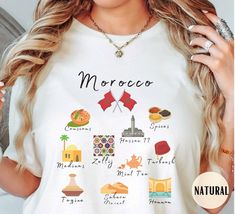 Show your love for Morocco in this ultra cute tee ♡  (fiber content may vary for different colors) ♡ Athletic Heather is 90% cotton, 10% polyester ♡ Solid black & Heather colors are 52% cotton and 48% polyester ♡ Light fabric (4.2 oz/yd² (142 g/m ♡ Retail fit ♡ Tear away label ♡ Runs true to size --------------------------------------------- Garment features: ♡ With side seams - located along the sides, they help hold the garment's shape longer and give it structural support ♡ Ribbed knit collar Graphic Tee Printed T-shirt As Gift, Graphic Tee Printed T-shirt For Gift, Printed Short Sleeve T-shirt Gift, White Printed Tops As A Gift, Moroccan Flag, Noir Uni, Knit Collar, Casablanca, Twill Tape