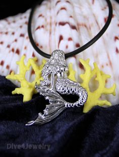 "Solid Sterling silver highly detailed Mermaid pendant necklace Comes with one Black Neoprene Necklace: 16-18\" or 18-20\" or 20-22\" or a 17\" silver tone ball chain Mermaid Size: 3.55cm x 3cm Pendant Weight: approx. 6.5 grams Pendant Metal type: Solid 925 STERLING SILVER with Anti-Tarnish RHODIUM Finish Item Stamped \"925\" for Sterling Silver New handmade style - designed by a scuba dive lover! ** I designed and we created this item. Owned by Dive4Jewelry** **Follow me on facebook for special Silver Sterling Silver Mermaid Necklaces, Ocean-inspired Silver Charm Necklace With Lobster Clasp, Adjustable Silver Necklace With Ocean-inspired Style, Silver Adjustable Ocean-inspired Necklace, Adjustable Silver Ocean-inspired Necklace, Mermaid Pendant Necklace, Ocean Girl, Fish Jewelry, Mermaid Pendant