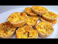 there are many small quiches on the plate