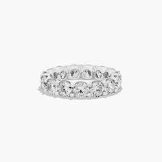 a white gold ring with rows of diamonds