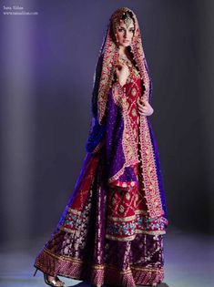 a woman in a purple and red wedding dress