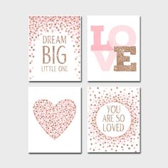 four cards with different designs on them, one in gold and the other in pink