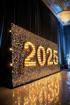 a large sign with lights on it that reads 2055 in front of a stage