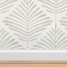 a white and grey wallpaper with leaves on it