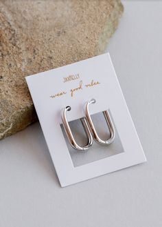 A modern rectangular cut and a bold shine, just launched in 925 silver. Lightweight to be easily wearable all day and all night. Now available in both Sterling Silver an 18kt Gold Vermeil. 925 sterling silver Ships on a crisp white card with gold foil script Outer diameter 21mm Curved ear wire and snap closure Rectangle Earrings, Gold Hoops, Jewelry Earrings Hoops, Silver Hoops, Silver Hoop Earrings, Ear Wire, Gold Vermeil, Rhodium Plated, Snap Closure