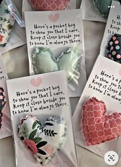 several pieces of heart shaped paper with words written on them and some hearts in the middle