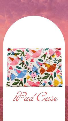 an ipad case with colorful birds and leaves on it, in front of a pink sky