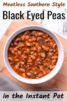 a white bowl filled with black eyed peas on top of a wooden cutting board next to a