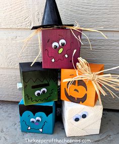 halloween treat boxes with faces painted on them