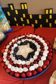 a cake made to look like the american flag with strawberries and blueberries on it