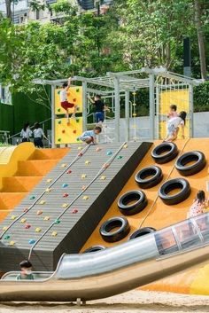 children playing on an inflatable playground slide