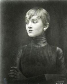 an old black and white photo of a woman