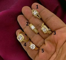 four different types of engagement rings on someone's hand with the numbers in front