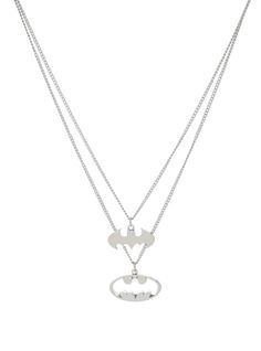 two silver necklaces with batman symbols on each one and the word's symbol