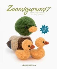 a crocheted book with two ducks and one duckling