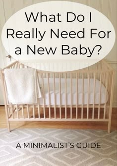 A crib made of natural wood with a cream blanket draped over the side. Loft Nursery Ideas Small Spaces, Simple Apartment Nursery, Nursery Decor Small Room, Nursery Room Minimalist, Nursery Room Essentials, Furniture For Nursery, Baby Room Must Haves, Minimal Nursery Ideas Gender Neutral, Nursery In Small Space