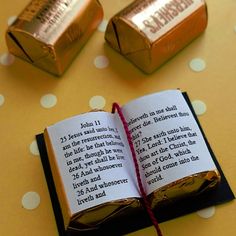 an open book sitting on top of a table next to two gold bars with the title, candy sculptures for easter