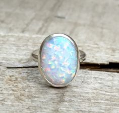 Statement Oval Simulated Opal Elegant Birthstone Ring in Sterling Silver by GildedBug on Etsy Boulder Opal Ring, Australian Opal Ring, Silver Opal Ring, Ethiopian Opal Ring, Opal Ring Gold, Sterling Silver Rings Bands, Jade Jewelry, Nature Jewelry, 925 Silver Rings