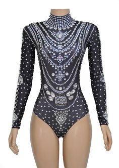 a mannequin wearing a bodysuit with lots of beads on it