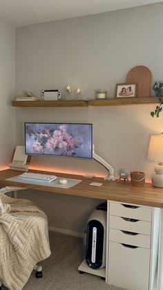 a desk with a computer monitor, keyboard and mouse