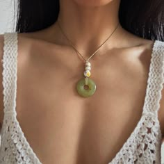 G R E E N ∙ S T O N E ∙ D O N U T ∙ N E C K L A C E ✨Features: * Material: Natural Green Stone, 8mm Freshwaster Pearl -2pcs, 10mm Cute Floral Bead -1pc, Wax Rope * Color: Green * Pendant Dimension: 1.2x1.2 inches / 3x3cm * Length: Adjustable, Max 47" / 120cm * Style: Boho Chic * Shipped with gift box * Handmade with love & care 📋Care Instructions: To maintain the luster of your choker, avoid contact with water, lotions, and perfumes. Store it in a cool, dry place when not in use. ✨Satisfaction Guaranteed: We stand by our craftsmanship. If you're not satisfied, contact us, and we'll make it right. EPISODE 33 Donut Stone Necklace, Green Stone Necklace, Green Pendants, Stone Beaded Necklace, Handcrafted Necklace, Handmade Jewelry Diy, Diy Crafts Jewelry, Jewelry Lookbook, Green Stone