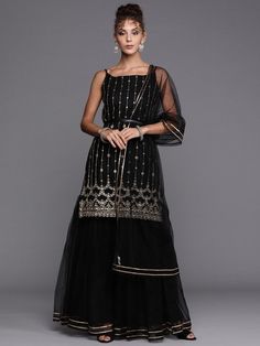 Black Gold Embroidered Kurta with Layered Sharara and Net Dupatta - Inddus.com Black And Gold Sharara, Black Semi-stitched Palazzo Set With Mirror Work, Floor-length Net Sharara For Eid, Black Georgette Sharara For Festive Occasions, Black Georgette Bollywood Sharara, Black Bollywood Style Georgette Sharara, Floor-length Net Sharara With Sheer Dupatta, Festive Black Georgette Sharara, Black Sharara With Dupatta For Party