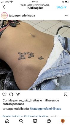 the back of a woman's stomach with butterflies on it