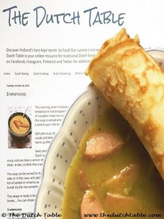 a bowl filled with soup and bread on top of a white tablecloth covered in information