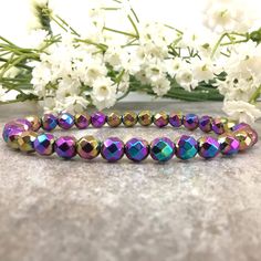 ✦Gemstone:Hematite  ✦Color: Rainbow ✦Shape: Faceted Round  ✦Length: 5''-9'' ✦Bead Size: 6mm ✦QTY: 1 pc / package ✦✦Please measure your wrist size, then order your bracelet. Experience the harmonizing energy of our Handmade 6mm Faceted Round Rainbow Hematite Bracelet, meticulously crafted to enhance your meditation and promote balance. This bracelet showcases vibrant rainbow hematite beads that are believed to resonate with the Root Chakra, grounding your energy and providing a sense of stability. It makes a meaningful holiday gift for yourself or a loved one. ✱Carefully handcrafted with intention and attention to detail. ✱An ideal gift for those interested in chakra healing and meditation. ✱Each bracelet is unique due to the natural variation in rainbow hematite beads. PLEASE NOTE: ▪️ Plea Healing Rainbow Natural Stone Bracelets, Rainbow 8mm Beads Spiritual Bracelet, Adjustable Rainbow Gemstone Bracelet, Rainbow Adjustable Hand-strung Stretch Bracelet, Rainbow Hematite, Hematite Jewelry, Healing Gemstone Bracelets, Grounding Energy, Meditation Bracelet