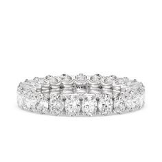 a white gold and diamond ring with five rows of diamonds on the band, set in 18k white gold