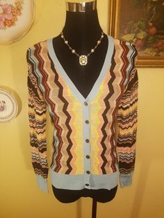 "Missoni for Target V-Neck Knit Cardigan Blue Multicolor Colore Chevron Size XS, M, XL Length: 25\" Chest: 34, 36, 38, 40 or 42\" when buttoned (Stretchy) Waist: same as chest Sleeve Length: 27\" Sizing: Women Sizing with a Contemporary Fit Material: 82% Rayon, 17% Cotton, 1% Gold thread Neckline Style: V-Neck Neckline Sleeve Style: Long Sleeves , Ribbed Cuffs Closure Style: Button Down Closures New with Tags SKU:163846016142_17843700-5397*" Colorful Gloves, Elbow Length Gloves, Velour Hoodie, Womens Sweaters, Knit Cardigan Sweater, Chenille Sweater, Gold Thread, Knit Sweater Cardigan, Missoni