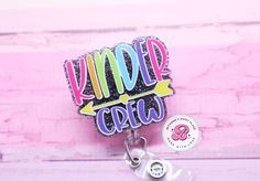 "Kindergarten crew badge reel: If you are looking for a unique gift then look no further! This retractable badge reel is perfect for any occasion.  Acrylic is 2\" Cord length 34\" You may choose a swivel clip, belt clip, lanyard, or carabiner. All badge reels come with dual lock fastener. They are interchangeable! Please do not allow children to play with the badge reels. Made in a smoke free studio. Don't hesitate to send me a message if you have questions. I will usually respond back within an Customizable Fun Badge Reel For Gifts, Personalized Multicolor Badge Reel For Teacher Appreciation, Personalized Fun Badge Reel For Gift, Personalized Fun Badge Reel Gift, Personalized Fun Pink Badge Reel, Playful Multicolor Badge Reel For Gifts, Playful Multicolor Badge Reel As Gift, Personalized Fun Craft Supplies For Teacher Appreciation, Personalized Multicolor Badge Holders For School