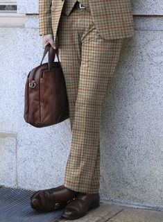 A nod to your profound fashion sense is our Loro Piana Abama Wool Silk Pants, which present themselves as elegant couture. Tailored with a wool-blended fabric, our pants have an exquisite look in the form of a checks pattern with different shades of brown hue that helps you transform into a royal personality. In addition to the fabric's gentle and light touch, these pairs give your formal wear a stylish twist and comfort at the highest peak. So obtain perfection with this piece that will stay in Luxurious Brands, Elegant Couture, Checks Pattern, Flannel Suit, Flannel Pants, Green Suit, Silk Suit, Silk Trousers, Light Touch