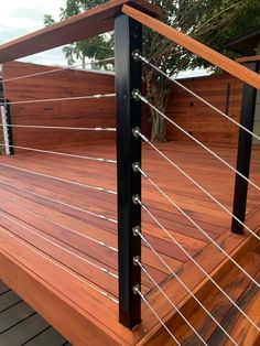 Hardwood Tigerwood deck with steel cable railing, gate and wall Backyard Deck Designs Railing, Minimal Deck Railing, Black Cable Deck Railing, Deck Railing Cable, Cable Fence Ideas, Wood Cable Railing, Cable Railing Interior, Deck Options