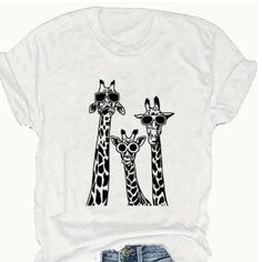 Very Cute White Tee With 3 Silly Giraffes! New In Package! Chest: 44 Inches Length: 25 Inches Box 6 White Cartoon Print T-shirt For Vacation, Casual Cartoon Print Tops For Vacation, Vacation Crew Neck T-shirt With Cartoon Print, Funny Tshirt, Shirts Women, Giraffes, White Tee, Funny Tshirts, Color White