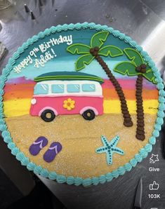 a birthday cake with a bus and palm trees on the beach in front of it